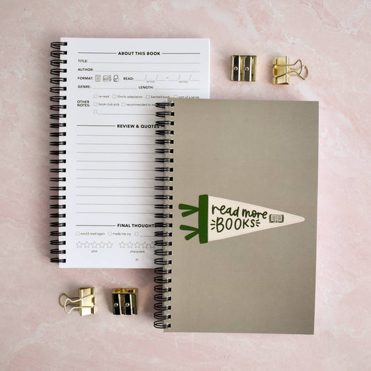 Book review journal with review pages, review prompts, and book tracking sections