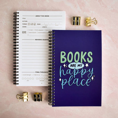 Notebook with 'Books are my happy place' design on a pink background