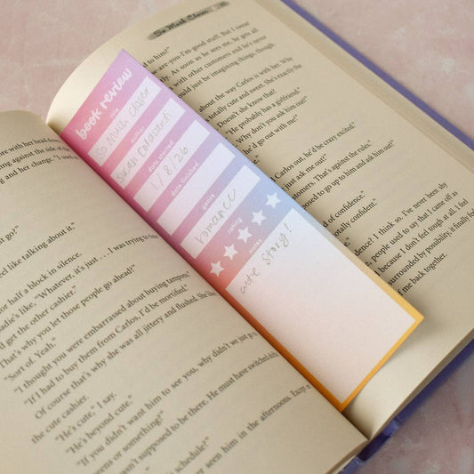 Colorful bookmark with book review text on an open book