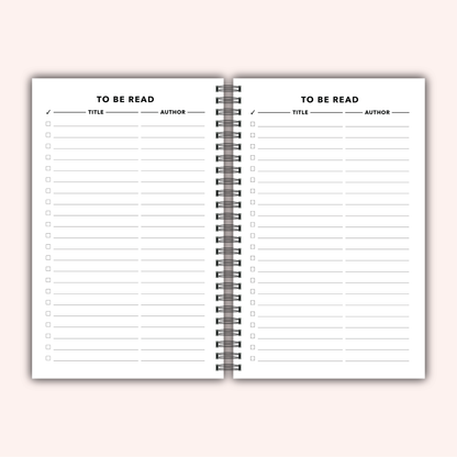 Open notebook with a to-do list and reading tracker on a light pink background